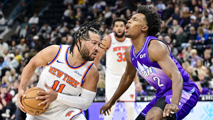 Nov 23, 2024; Salt Lake City, Utah, USA; New York Knicks guard Jalen Brunson (11) collides with Utah Jazz guard Collin Sexton (2) during the first half at the Delta Center. Mandatory Credit: Christopher Creveling-Imagn Images