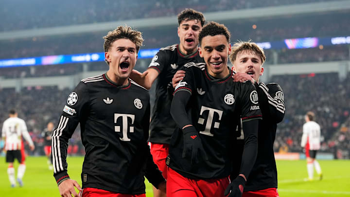Bayern Munich players celebrating a goal against PSV Eindhoven. Bayern Munich players celebrating a goal against PSV Eindhoven.
