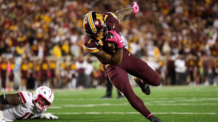 Oct 17, 2025; Minneapolis, Minnesota, USA; Minnesota Golden Gophers running back Darius Taylor (1) runs for a touchdown against the Nebraska Cornhuskers during the second half at Huntington Bank Stadium.