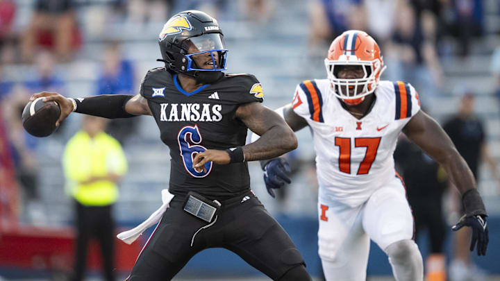Sep 8, 2023; Lawrence, Kansas, USA; Kansas Jayhawks quarterback Jalon Daniels (6) throws a pass against Illinois Fighting Illini linebacker Gabe Jacas (17) during the first half at David Booth Kansas Memorial Stadium. Mandatory Credit: Jay Biggerstaff-Imagn Images Sep 8, 2023; Lawrence, Kansas, USA; Kansas Jayhawks quarterback Jalon Daniels (6) throws a pass against Illinois Fighting Illini linebacker Gabe Jacas (17) during the first half at David Booth Kansas Memorial Stadium. Mandatory Credit: Jay Biggerstaff-Imagn Images