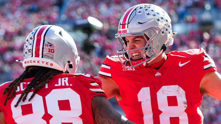 Ohio State Buckeyes quarterback Will Howard (18) celebrates with tight end Gee Scott Jr. (88) after Scott scored a touchdown in the first half at Ohio Stadium on Saturday, Nov. 9, 2024 in Columbus, Ohio.