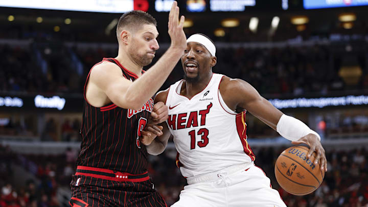 Nov 21, 2025; Chicago, Illinois, USA; Chicago Bulls center Nikola Vucevic (9) defends against Miami Heat center Bam Adebayo (13) during the second half at United Center. Mandatory Credit: Kamil Krzaczynski-Imagn Images Nov 21, 2025; Chicago, Illinois, USA; Chicago Bulls center Nikola Vucevic (9) defends against Miami Heat center Bam Adebayo (13) during the second half at United Center. Mandatory Credit: Kamil Krzaczynski-Imagn Images