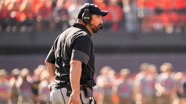 Ohio State Buckeyes head coach Ryan Day watches during the first half of the NCAA football game against the Illinois Fighting Illini at Gies Memorial Stadium in Champaign on Oct. 11, 2025. Ohio State Buckeyes head coach Ryan Day watches during the first half of the NCAA football game against the Illinois Fighting Illini at Gies Memorial Stadium in Champaign on Oct. 11, 2025.