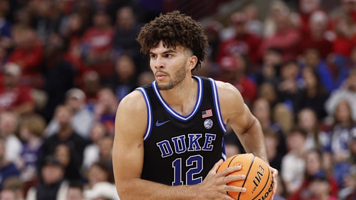 Nov 27, 2025; Chicago, Illinois, USA; Duke Blue Devils forward Cameron Boozer (12) looks to pass the ball against Arkansas Razorbacks during the second half at United Center. Mandatory Credit: Kamil Krzaczynski-Imagn Images