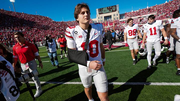 Ohio State Buckeyes quarterback Julian Sayin (10) leaves the field in a sling following the 19-15 win over the Indiana Hoosiers in the NCAA football game at Memorial Stadium Stadium in Bloomington, Ind. on Oct. 17, 2026.