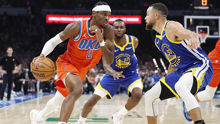 Nov 10, 2024; Oklahoma City, Oklahoma, USA; Oklahoma City Thunder guard Shai Gilgeous-Alexander (2) drives to the basket against Golden State Warriors guard Stephen Curry (30) during the second quarter at Paycom Center. Mandatory Credit: Alonzo Adams-Imagn Images