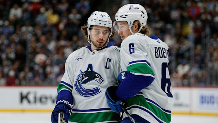 Apr 10, 2025; Denver, Colorado, USA; Vancouver Canucks defenseman Quinn Hughes (43) and right wing Brock Boeser (6) in the first period against the Colorado Avalanche at Ball Arena. Mandatory Credit: Isaiah J. Downing-Imagn Images