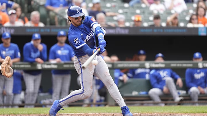 May 4, 2025; Baltimore, Maryland, USA; Kansas City Royals shortstop Bobby Witt Jr. (7) hits an RBI double against the Baltimore Orioles during the eighth inning at Oriole Park at Camden Yards. Mandatory Credit: Gregory Fisher-Imagn Images