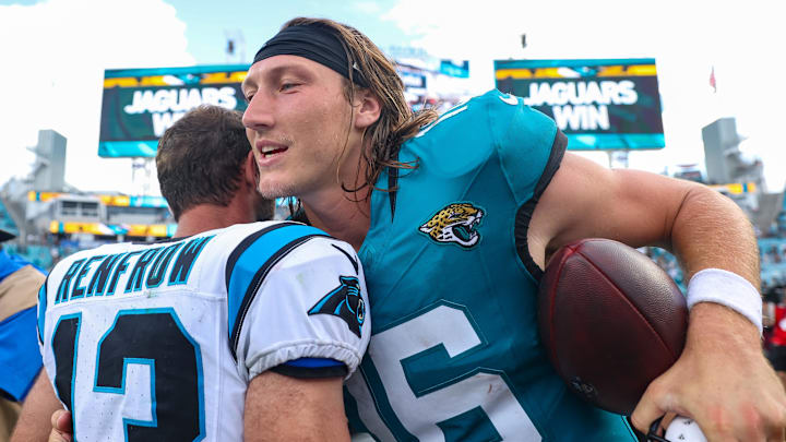 Sep 7, 2025; Jacksonville, Florida, USA; Carolina Panthers wide receiver Hunter Renfrow (13) is hugged Jacksonville Jaguars quarterback Trevor Lawrence (16) following a game at EverBank Stadium. Mandatory Credit: Morgan Tencza-Imagn Images Sep 7, 2025; Jacksonville, Florida, USA; Carolina Panthers wide receiver Hunter Renfrow (13) is hugged Jacksonville Jaguars quarterback Trevor Lawrence (16) following a game at EverBank Stadium. Mandatory Credit: Morgan Tencza-Imagn Images