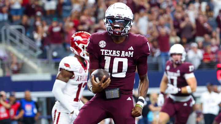 Sep 28, 2024; Arlington, Texas, USA; Texas A&M Aggies quarterback Marcel Reed (10) reacts after scoring a touchdown during the first half against the Arkansas Razorbacks at AT&T Stadium. Sep 28, 2024; Arlington, Texas, USA; Texas A&M Aggies quarterback Marcel Reed (10) reacts after scoring a touchdown during the first half against the Arkansas Razorbacks at AT&T Stadium.