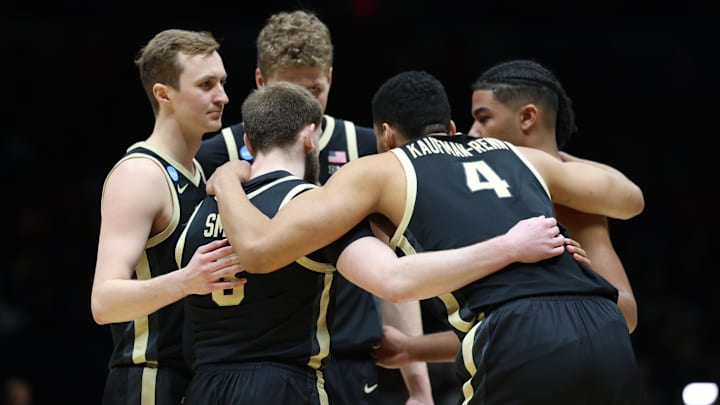 The starting five for the Purdue Boilermakers huddle up against the Houston Cougars 