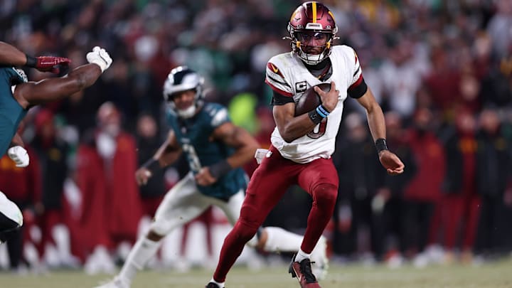 Jan 26, 2025; Philadelphia, PA, USA; Washington Commanders quarterback Jayden Daniels (5) runs with the ball against the Philadelphia Eagles during the second half in the NFC Championship game at Lincoln Financial Field. 