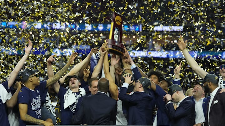 Apr 3, 2023; Houston, TX, USA; Connecticut Huskies players hoist the national championship trophy