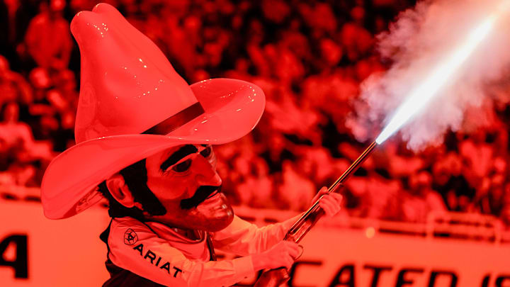 Oklahoma State’s Pistol Pete fires a shotgun before an NCAA wrestling meet between Oklahoma State and Missouri at Gallagher-Iba Arena in Stillwater, Okla., on Sunday, Feb. 2, 2025.