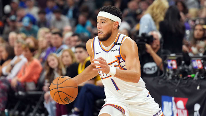 Phoenix Suns guard Devin Booker (1) dribbles against the Los Angeles Lakers during the first half at Footprint Center. Mandatory Credit: Joe Camporeale-Imagn Images