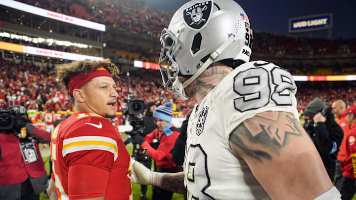 Nov 29, 2024; Kansas City, Missouri, USA; Kansas City Chiefs quarterback Patrick Mahomes (15) talks with Las Vegas Raiders defensive end Maxx Crosby (98) after a game at GEHA Field at Arrowhead Stadium. Mandatory Credit: Jay Biggerstaff-Imagn Images