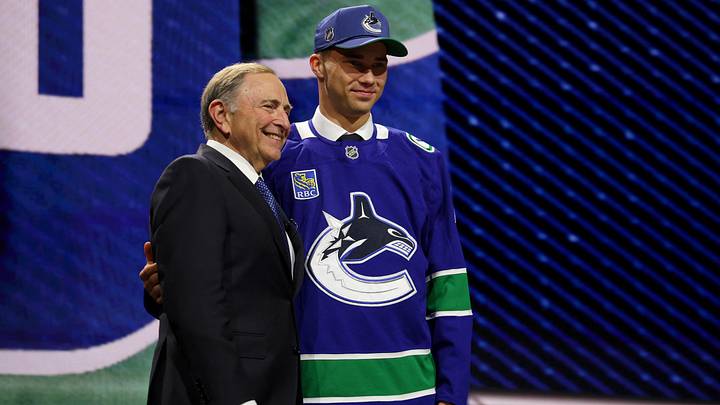 Jun 26, 2026; Buffalo, New York, USA; Adam Novotny reacts beside NHL commissioner Gary Bettman after being selected with the twenty fourth pick in the first round of the 2026 NHL Draft by the Vancouver Canucks at KeyBank Center. Mandatory Credit: Timothy T. Ludwig-Imagn Images Jun 26, 2026; Buffalo, New York, USA; Adam Novotny reacts beside NHL commissioner Gary Bettman after being selected with the twenty fourth pick in the first round of the 2026 NHL Draft by the Vancouver Canucks at KeyBank Center. Mandatory Credit: Timothy T. Ludwig-Imagn Images