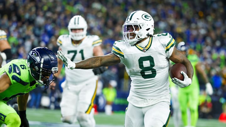 Green Bay Packers running back Josh Jacobs carries the ball against the Seattle Seahawks.