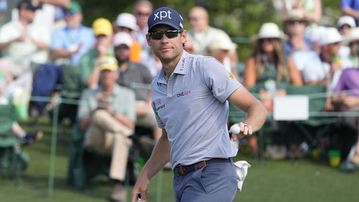Adam Schenk reacts on the 18th green 