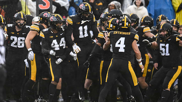 Nov 8, 2025; Iowa City, Iowa, USA; The Iowa Hawkeyes react after an interception by defensive back Deshaun Lee (obscured) during the first quarter against the Oregon Ducks at Kinnick Stadium. Mandatory Credit: Jeffrey Becker-Imagn Images Nov 8, 2025; Iowa City, Iowa, USA; The Iowa Hawkeyes react after an interception by defensive back Deshaun Lee (obscured) during the first quarter against the Oregon Ducks at Kinnick Stadium. Mandatory Credit: Jeffrey Becker-Imagn Images
