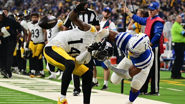 Sep 29, 2024; Indianapolis, Indiana, USA; Indianapolis Colts safety Nick Cross (20) knocks the ball out of hands of Pittsburgh Steelers wide receiver George Pickens (14) for a fumble during the second quarter at Lucas Oil Stadium. Mandatory Credit: Marc Lebryk-Imagn Images