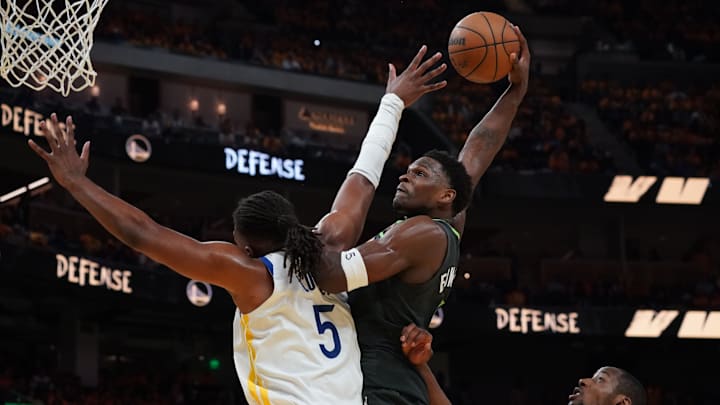 Minnesota Timberwolves guard Anthony Edwards dunks over Golden State Warriors forward Kevon Looney in the third quarter during Game 3 of a Western Conference semifinal at Chase Center in San Francisco on May 10, 2025.