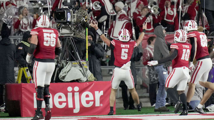 Wisconsin quarterback Carter Smith (5) celebrates his touchdown run during the third quarter of their game Saturday, November 8, 2025 at Camp Randall Stadium in Madison, Wisconsin. Wisconsin beat Washington 13-10. Wisconsin quarterback Carter Smith (5) celebrates his touchdown run during the third quarter of their game Saturday, November 8, 2025 at Camp Randall Stadium in Madison, Wisconsin. Wisconsin beat Washington 13-10.