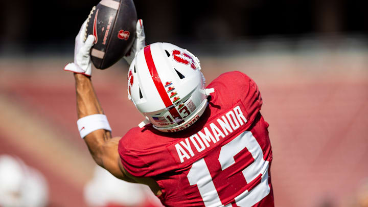 Nov 16, 2024; Stanford, California, USA; Stanford Cardinal wide receiver Elic Ayomanor (13) catches a pass in warmup before the game against the Louisville Cardinals at Stanford Stadium. Mandatory Credit: Bob Kupbens-Imagn Images Nov 16, 2024; Stanford, California, USA; Stanford Cardinal wide receiver Elic Ayomanor (13) catches a pass in warmup before the game against the Louisville Cardinals at Stanford Stadium. Mandatory Credit: Bob Kupbens-Imagn Images