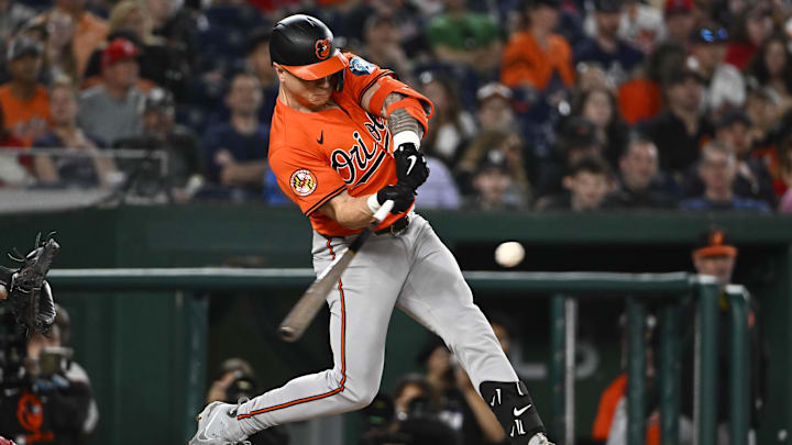 Apr 23, 2025; Washington, District of Columbia, USA; Baltimore Orioles outfielder Tyler O'Neill (9) hits a RBI sacrifice fly against the Washington Nationals during the seventh inning at Nationals Park. 