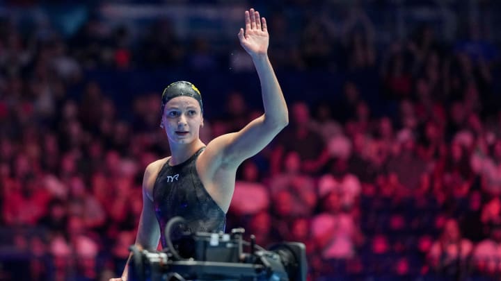 Katie Grimes waves to the crowd after winning the 400-meter individual medley final Monday during the third day of competition for the U.S. Olympic Team Swimming Trials at Lucas Oil Stadium in Indianapolis. Katie Grimes waves to the crowd after winning the 400-meter individual medley final Monday during the third day of competition for the U.S. Olympic Team Swimming Trials at Lucas Oil Stadium in Indianapolis.