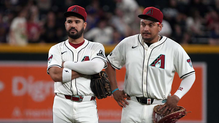 Jun 9, 2025; Phoenix, Arizona, USA; Arizona Diamondbacks third base Eugenio Suarez (28) and first base Josh Naylor (22) talk in the ninth inning against the Seattle Mariners at Chase Field. Mandatory Credit: Rick Scuteri-Imagn Images
