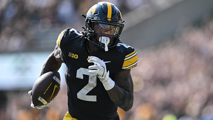 Oct 12, 2024; Iowa City, Iowa, USA; Iowa Hawkeyes running back Kaleb Johnson (2) runs for a 17 yard touchdown run during the second quarter against the Washington Huskies at Kinnick Stadium. Mandatory Credit: Jeffrey Becker-Imagn Images