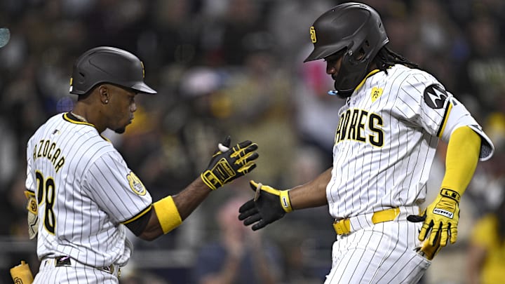 Apr 27, 2024; San Diego, California, USA; San Diego Padres third baseman Eguy Rosario (right) is congratulated by left fielder Jose Azocar (28) after hitting a home run against the Philadelphia Phillies during the eighth inning at Petco Park. Mandatory Credit: Orlando Ramirez-Imagn Images