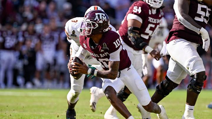 Texas A&M Aggies quarterback Marcel Reed (10) eludes the tackle of Miami Hurricanes defensive lineman Akheem Mesidor (3) during the game between the Aggies and the Hurricanes at Kyle Field. Texas A&M Aggies quarterback Marcel Reed (10) eludes the tackle of Miami Hurricanes defensive lineman Akheem Mesidor (3) during the game between the Aggies and the Hurricanes at Kyle Field.
