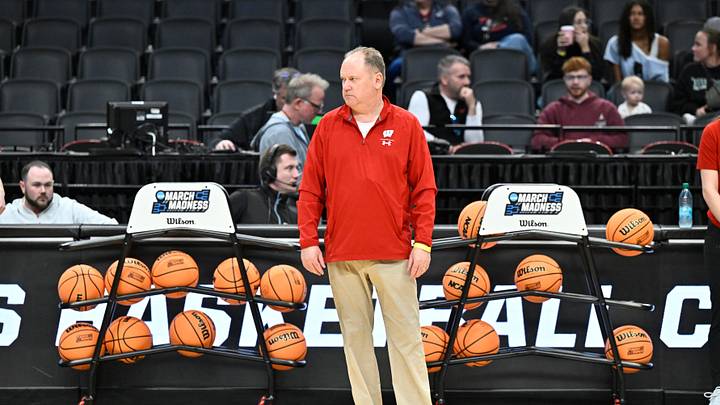 Mar 18, 2026; Portland, OR, USA; Wisconsin Badgers head coach Greg Gard watches warmups during a practice session ahead of the first round of the men's 2026 NCAA Tournament at Moda Center. Mandatory Credit: Craig Strobeck-Imagn Images