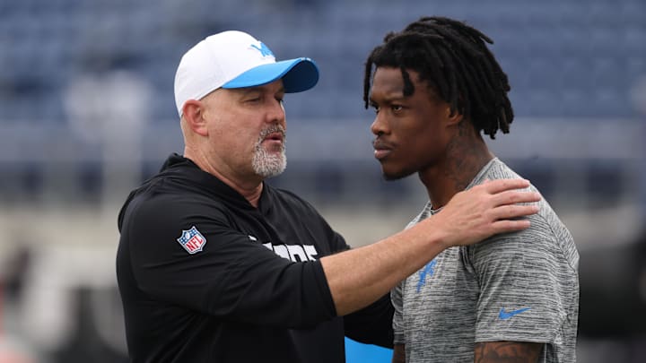 Jul 31, 2025; Canton, Ohio, USA;  Detroit Lions offensive coordinator John Morton instructs wide receiver Jameson Williams (1) before the game against the Los Angeles Chargers at Tom Benson Hall of Fame Stadium. Mandatory Credit: Charles LeClaire-Imagn Images Jul 31, 2025; Canton, Ohio, USA;  Detroit Lions offensive coordinator John Morton instructs wide receiver Jameson Williams (1) before the game against the Los Angeles Chargers at Tom Benson Hall of Fame Stadium. Mandatory Credit: Charles LeClaire-Imagn Images