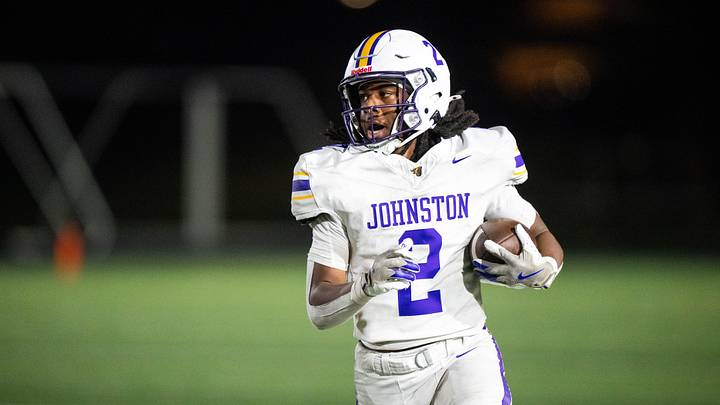 Johnston's Emri Jones (2) runs the ball against Ankeny on Oct. 3, 2025, at Ankeny Stadium.