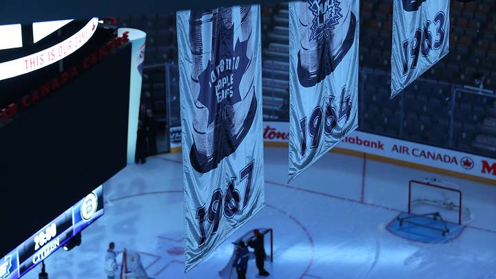The Stanley Cup winning banners loom over the ice The Stanley Cup winning banners loom over the ice