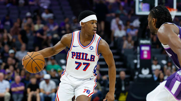 Mar 19, 2026; Sacramento, California, USA; Philadelphia 76ers guard Vj Edgecombe (77) dribbles the ball against Sacramento Kings forward Precious Achiuwa (9) during the second quarter at Golden 1 Center. Mandatory Credit: Sergio Estrada-Imagn Images