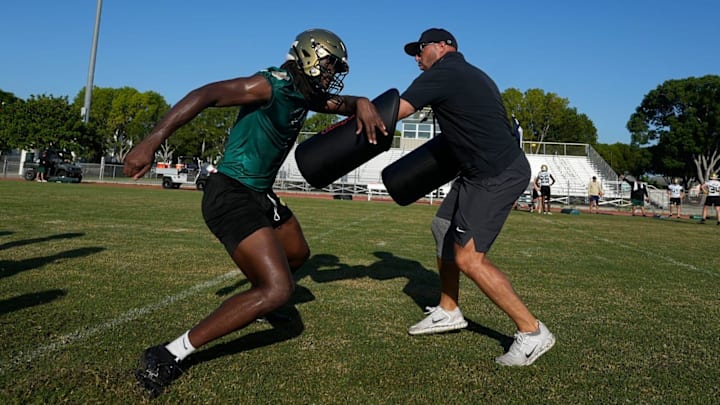 St. John Neumann High School football player Jayden Petit completes practice drills Tuesday morning July 29, 2025.