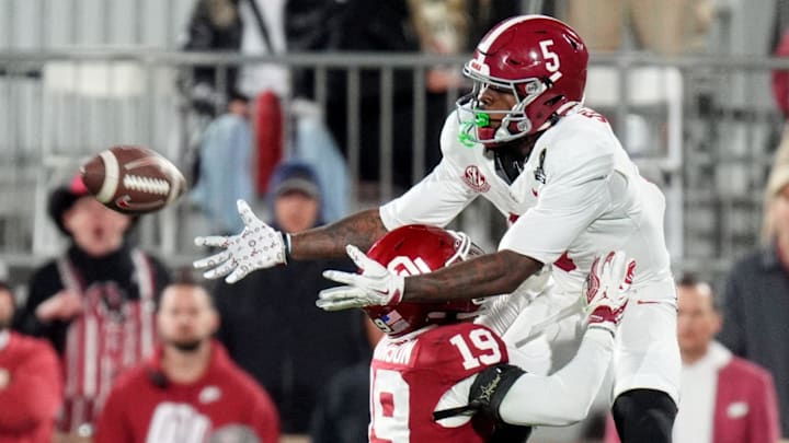 Alabama 's Germie Bernard (5) makes a catch over Oklahoma's Gentry Williams (9) during the College Football Playoff game between the University of Oklahoma Sooners (OU) and the Alabama Crimson Tide at the Gaylord Family – Oklahoma Memorial Stadium in Norman, Okla., Friday Dec. 19, 2025.