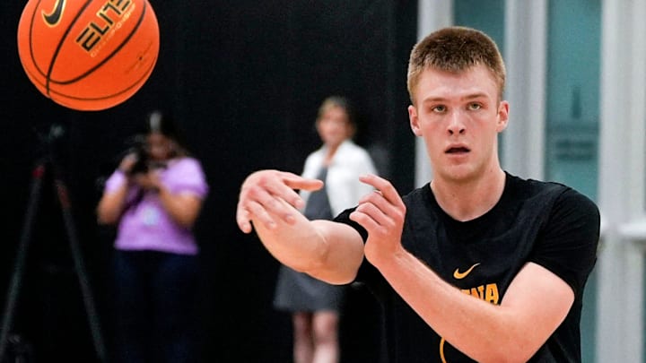 Iowa’s Bennett Stirtz (14) passes the ball during practice June 19, 2025 at Carver-Hawkeye Arena in Iowa City, Iowa.