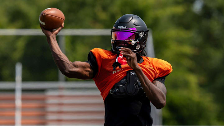 Quarterback Bryce Underwood throws a pass during a team practice at the Belleville High School football field in Belleville on Wednesday, Aug. 14, 2024. Quarterback Bryce Underwood throws a pass during a team practice at the Belleville High School football field in Belleville on Wednesday, Aug. 14, 2024.