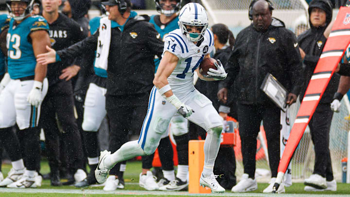Dec 7, 2025; Jacksonville, Florida, USA; Indianapolis Colts wide receiver Alec Pierce (14) runs with the ball against the Jacksonville Jaguars during the first half at EverBank Stadium. Mandatory Credit: Matt Pendleton-Imagn Images