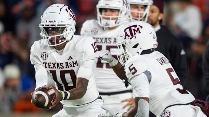 Texas A&M Aggies quarterback Marcel Reed (10) hands the ball off to running back Amari Daniels (5) during warm ups before Auburn Tigers take on Texas A&M Aggies at Jordan-Hare Stadium in Auburn, Ala., on Saturday, Sept. 7, 2024. Texas A&M Aggies quarterback Marcel Reed (10) hands the ball off to running back Amari Daniels (5) during warm ups before Auburn Tigers take on Texas A&M Aggies at Jordan-Hare Stadium in Auburn, Ala., on Saturday, Sept. 7, 2024.