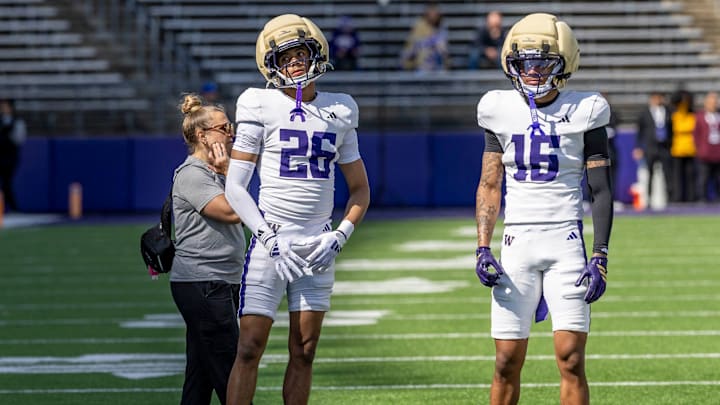 Elias Johnson (26) and Ramonz Adams Jr. (16) share a spring moment. 