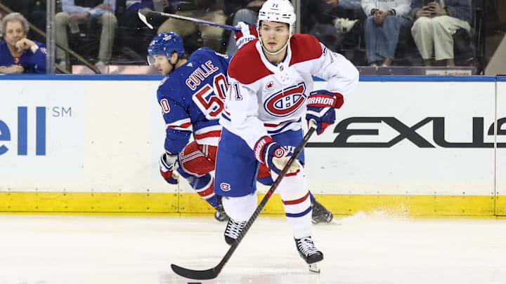 Apr 2, 2026; New York, New York, USA;  Montréal Canadiens center Jake Evans (71) controls the puck in the first period against the New York Rangers at Madison Square Garden. Mandatory Credit: Wendell Cruz-Imagn Images