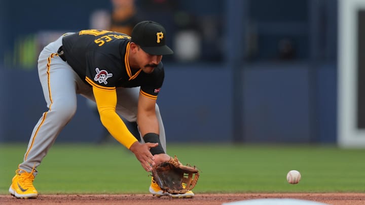 Mar 27, 2025; Miami, Florida, USA; Pittsburgh Pirates second baseman Nick Gonzales (39) catches a ground ball against Miami Marlins first baseman Jonah Bride (not pictured) during the first inning at loanDepot Park. Mandatory Credit: Sam Navarro-Imagn Images
