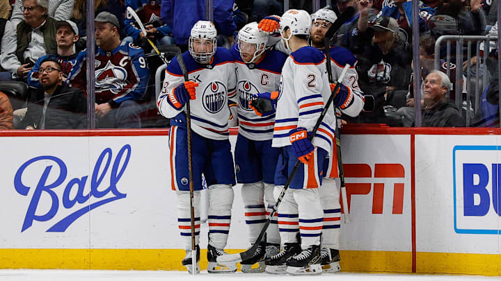 Jan 16, 2025; Denver, Colorado, USA; Edmonton Oilers center Connor McDavid (97) celebrates his goal with left wing Zach Hyman (18) and center Leon Draisaitl (29) and defenseman Evan Bouchard (2) in the second period against the Colorado Avalanche at Ball Arena. Mandatory Credit: Isaiah J. Downing-Imagn Images
