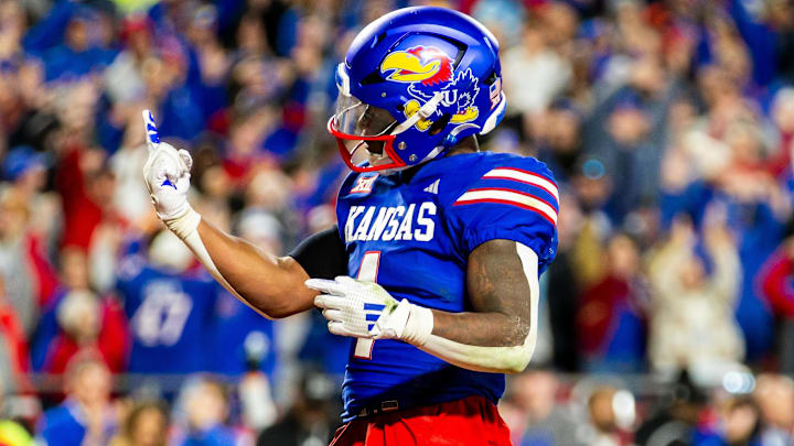 Nov 23, 2024; Kansas City, Missouri, USA; Kansas running back Devin Neal (4) gestures after scoring a touchdown during the 4th quarter between the Kansas Jayhawks and the Colorado Buffaloes at GEHA Field at Arrowhead Stadium. Nov 23, 2024; Kansas City, Missouri, USA; Kansas running back Devin Neal (4) gestures after scoring a touchdown during the 4th quarter between the Kansas Jayhawks and the Colorado Buffaloes at GEHA Field at Arrowhead Stadium.